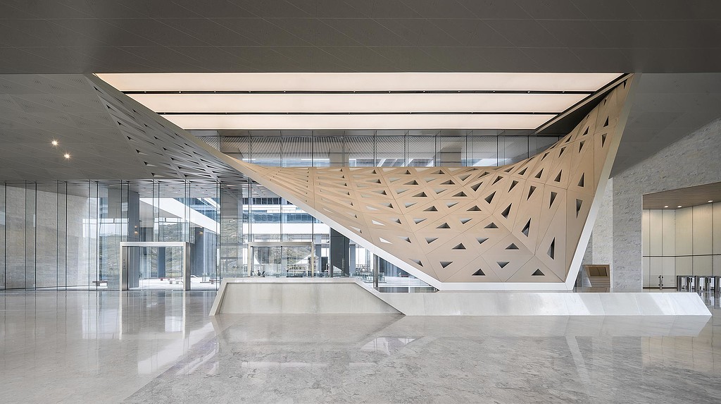 A large white building with a curved staircase.